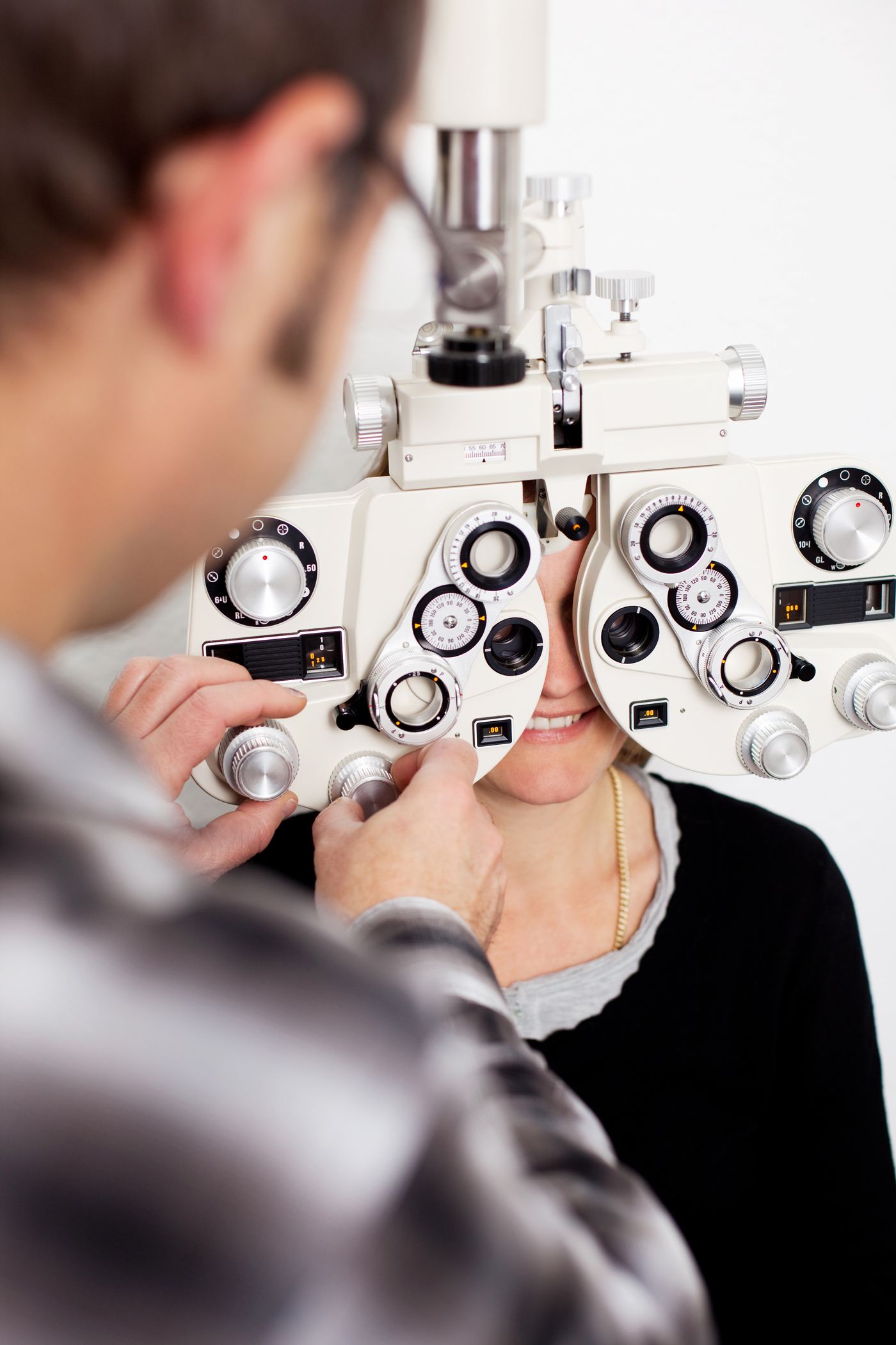 Exam room at Pearle Vision Whitby with phoropter and eye chart