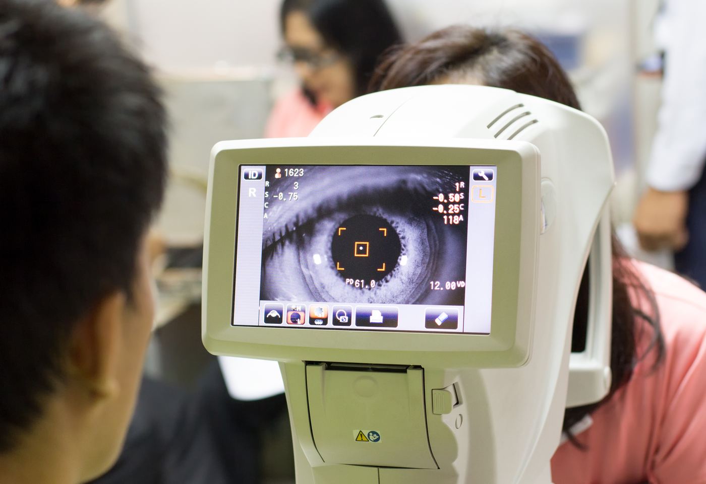 Comprehensive eye exam using phoropter at Pearle Vision Whitby